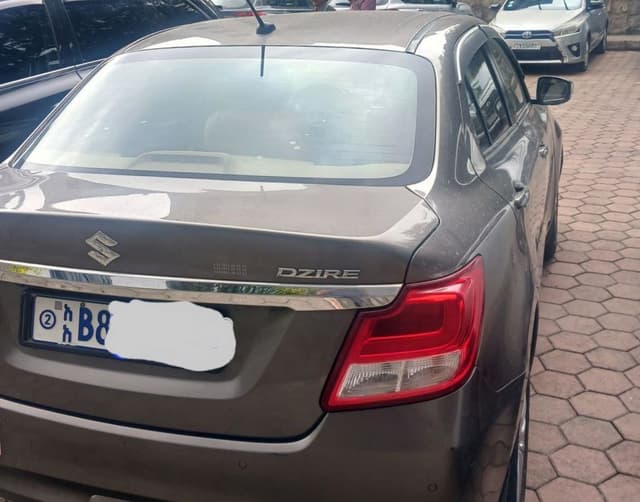 Suzuki Dzire (Cream )